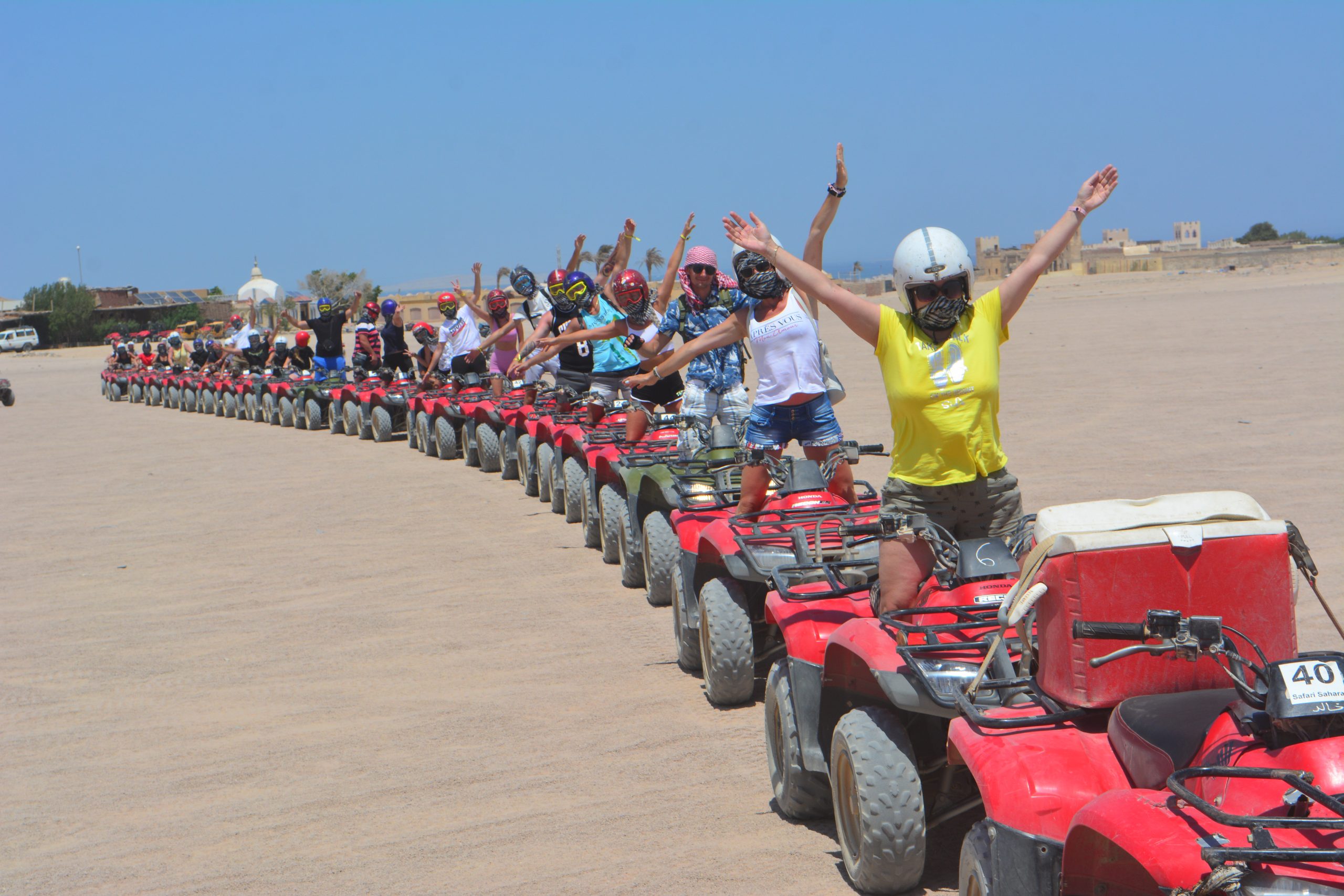 Quad bikes crossing the Hurghada desert at sunset