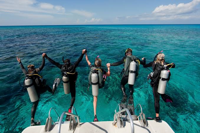 Scuba divers preparing to enter the Red Sea from a Hurghada dive boat