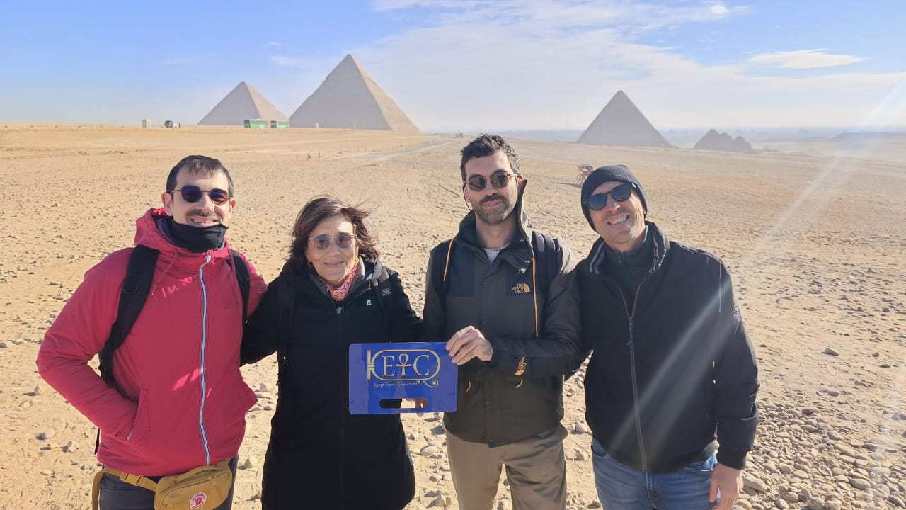 Happy family walking together on a bright beach during their Grand Egypt Family Adventure