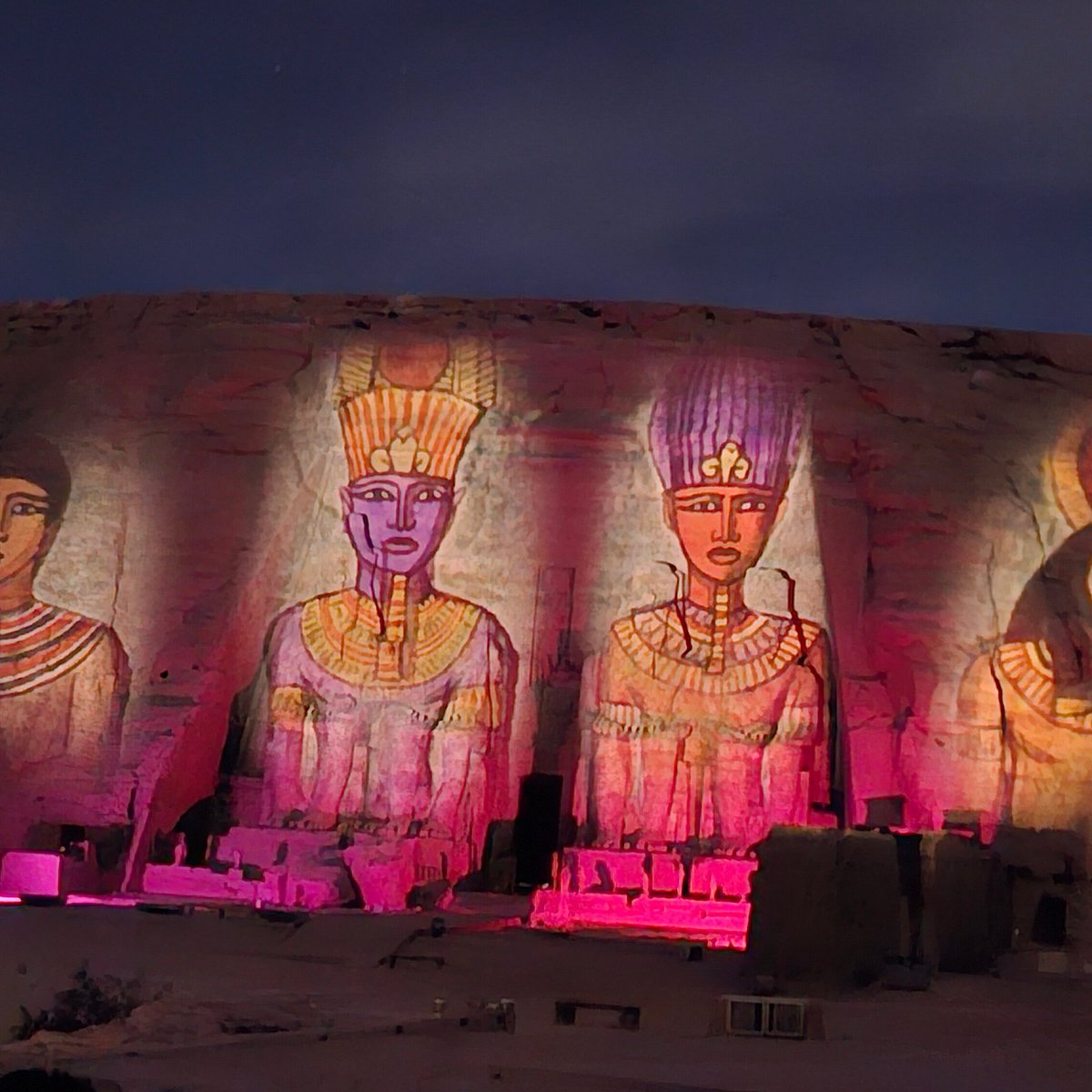 Temple of Queen Nefertari illuminated at night in Abu Simbel