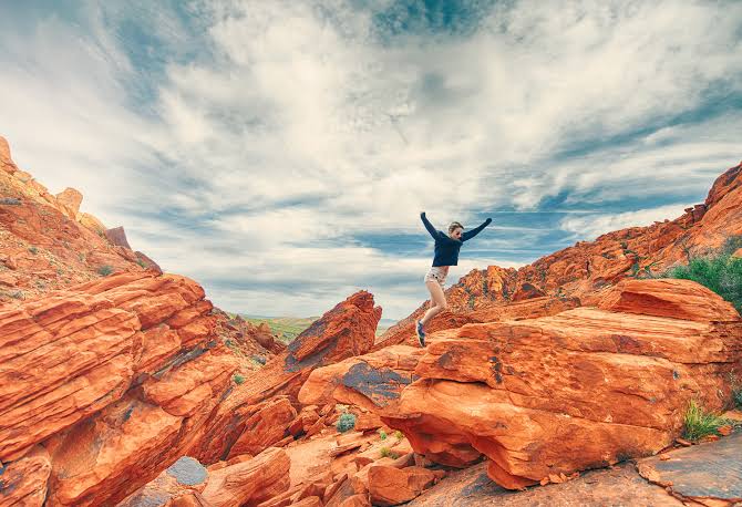 A traveler exploring the dramatic sandstone formations of Sinai